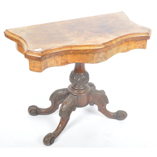 287 - A 19th Century Victorian walnut card / games table having a serpentine chamfered edge fold over top ... 