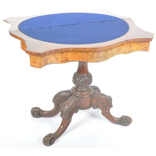 287 - A 19th Century Victorian walnut card / games table having a serpentine chamfered edge fold over top ... 