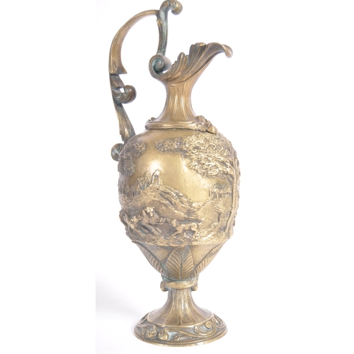 289 - A 19th Century Italian Grand Tour bronze ewer jug having relief cast hunting stag scenes with scroll... 