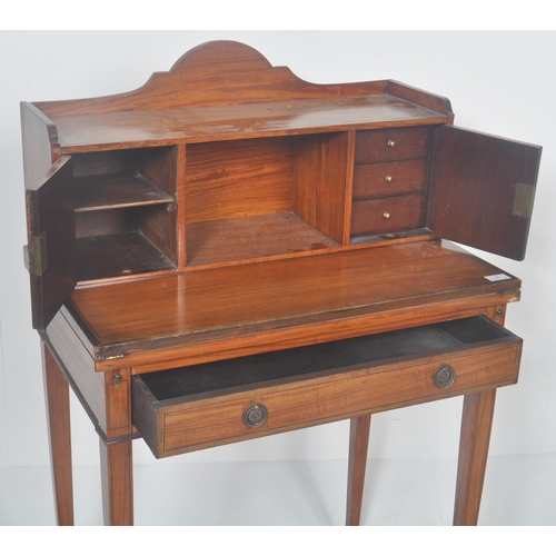 291 - A 19th Century Satinwood Bonheur De Jour Victorian Ladies writing table desk. Comprises an arched ga... 