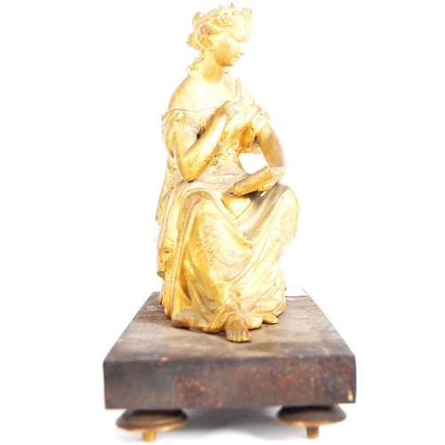 293 - A 19th Century gilded bronze figurine in the form of a seated classical maiden. Reading from a scrol... 