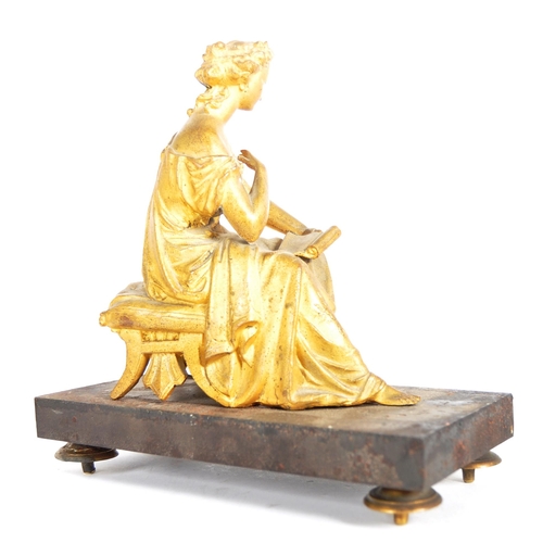 293 - A 19th Century gilded bronze figurine in the form of a seated classical maiden. Reading from a scrol... 