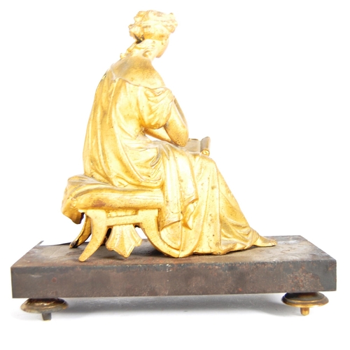 293 - A 19th Century gilded bronze figurine in the form of a seated classical maiden. Reading from a scrol... 