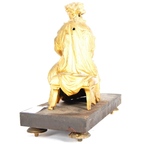 293 - A 19th Century gilded bronze figurine in the form of a seated classical maiden. Reading from a scrol... 