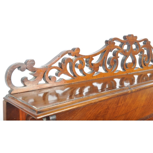 295 - A 19th Century Victorian mahogany open bookcase having a carved scrolled folate top with shelf below... 