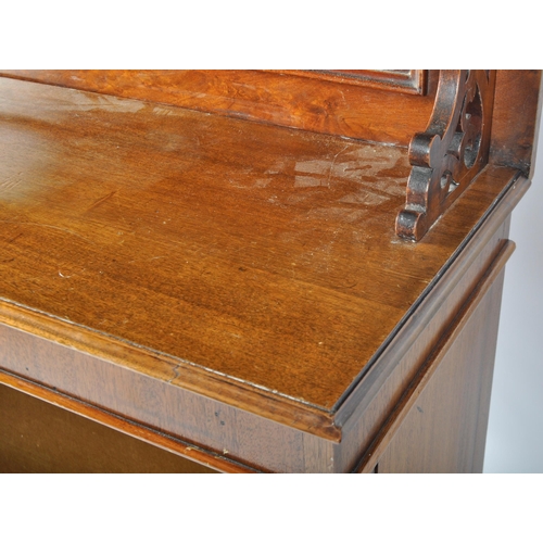 295 - A 19th Century Victorian mahogany open bookcase having a carved scrolled folate top with shelf below... 