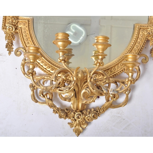 300 - A pair of 19th Century large gilt wood and gesso worked girandole wall mirrors. Each mirror adorned ... 