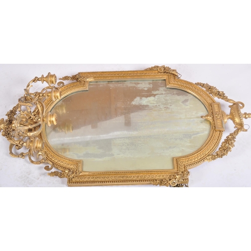 300 - A pair of 19th Century large gilt wood and gesso worked girandole wall mirrors. Each mirror adorned ... 