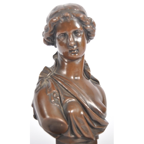 301 - A 19th Century bronze figurine in the form of a bust of a young woman / maiden. Hair modelled up set... 