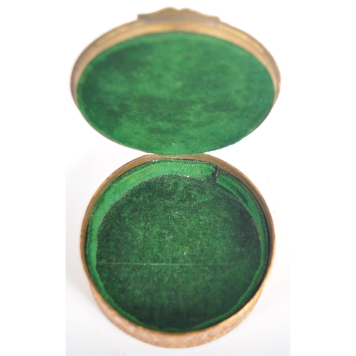 302 - A 19th century French Palais Royal Enamel Trinket Box. A gilded bronze of circular form with a hinge... 