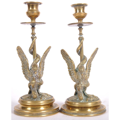 309 - A 19th Century bronze desk set set with eagles killing snakes. Comprises a letter opener / paper kni... 