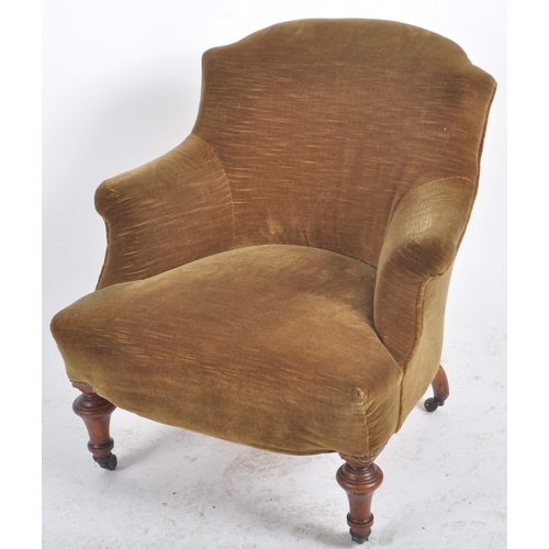 310 - A 19th Century Victorian armchair having a shaped backrest and overstuffed padded seat rest. All rai... 