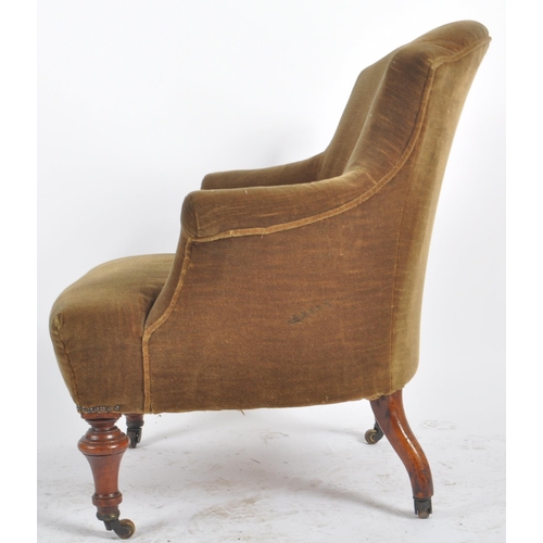 310 - A 19th Century Victorian armchair having a shaped backrest and overstuffed padded seat rest. All rai... 