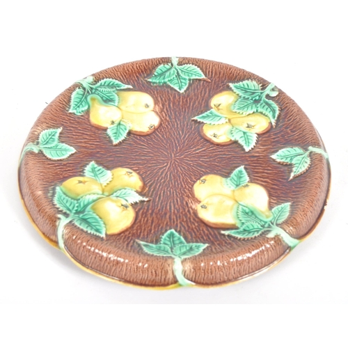 312 - A pair of 19th Century Majolica serving plates. A oval bread plate / basket with flower at the centr... 