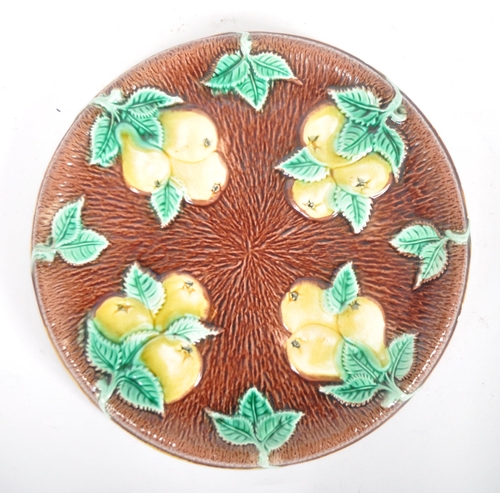 312 - A pair of 19th Century Majolica serving plates. A oval bread plate / basket with flower at the centr... 