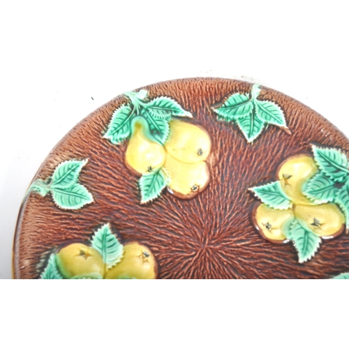 312 - A pair of 19th Century Majolica serving plates. A oval bread plate / basket with flower at the centr... 