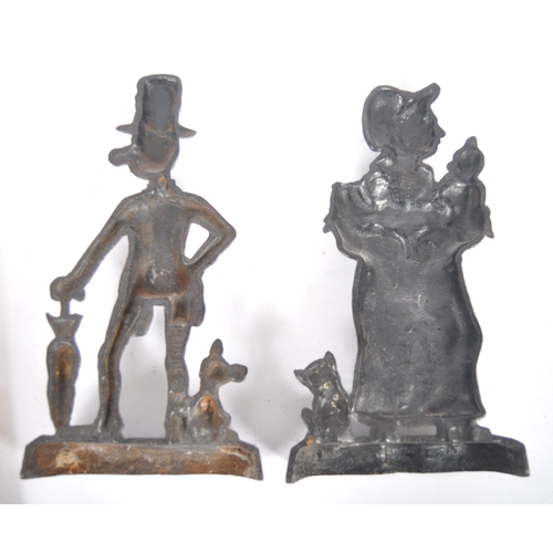 316 - A pair of 19th Century Victorian cast iron doorstops. Two late Victorian door stops, one in the form... 