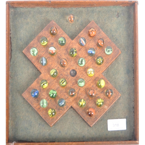 318 - A 19th Century Victorian oak solitaire board. An early Victorian wooden solitaire board in the form ... 