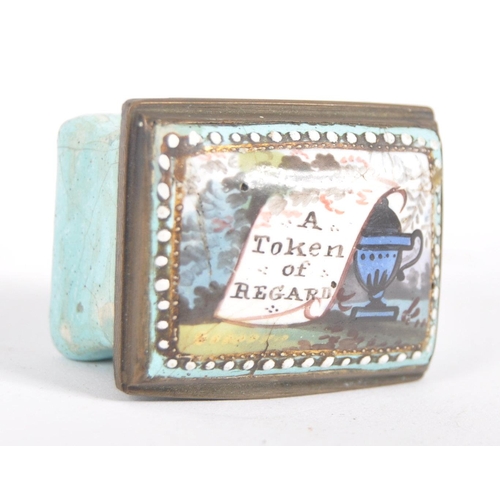 324 - A 19th century square enamelled pill box, the copper lid inset an enamelled with the text 