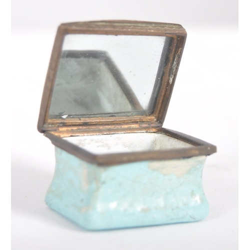 324 - A 19th century square enamelled pill box, the copper lid inset an enamelled with the text 