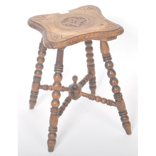 325 - A 19th Century William & Mary revival carved oak gypsy table having a shaped top with central decora... 