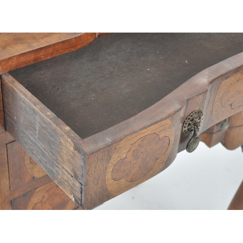 337 - An early 20th Century Queen Anne style walnut bureau desk having a fall front section top opening to... 