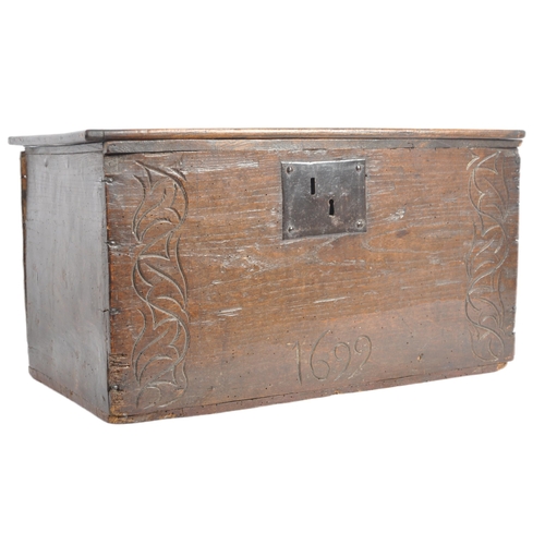 342 - A 17th century and later oak carved bible box. Of large proportions, the hinged lid opening to revea... 