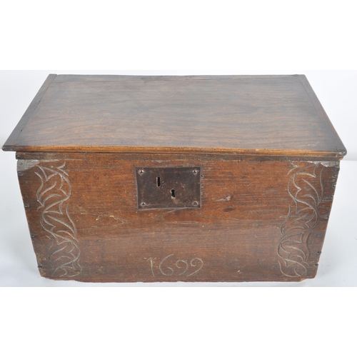 342 - A 17th century and later oak carved bible box. Of large proportions, the hinged lid opening to revea... 