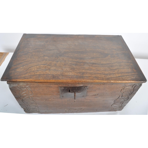 342 - A 17th century and later oak carved bible box. Of large proportions, the hinged lid opening to revea... 