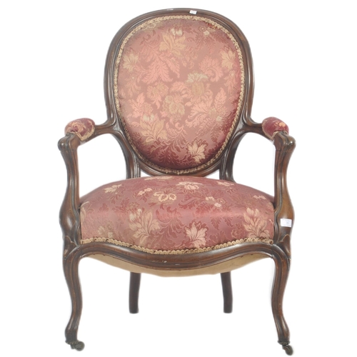 35 - A 19th Century Victorian rosewood salon armchair / chair. Shaped back with carved decoration. Pink f... 