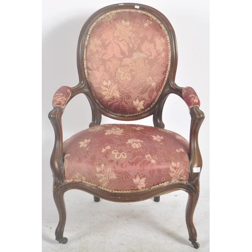 35 - A 19th Century Victorian rosewood salon armchair / chair. Shaped back with carved decoration. Pink f... 