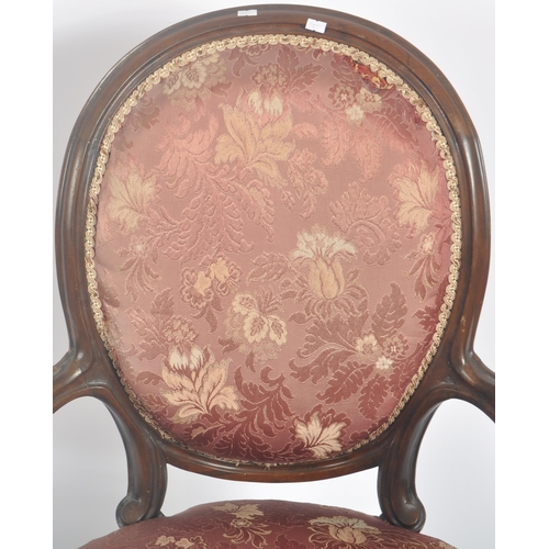 35 - A 19th Century Victorian rosewood salon armchair / chair. Shaped back with carved decoration. Pink f... 