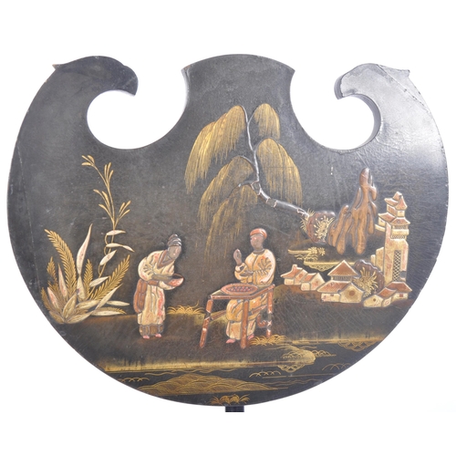 351 - A 19th Century Regency black lacquered pole screen having a shaped panel with chinoiserie scene of f... 