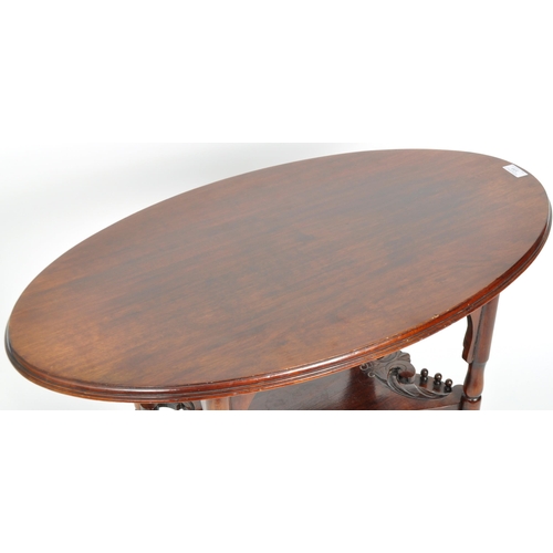 355 - A 19th Century Victorian mahogany side occasional drinks table having an oval top with central tier ... 