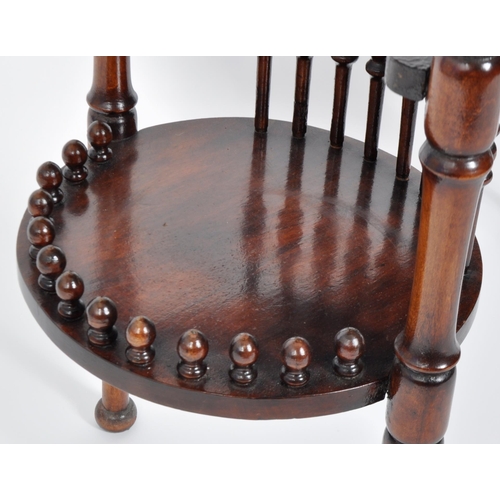 355 - A 19th Century Victorian mahogany side occasional drinks table having an oval top with central tier ... 