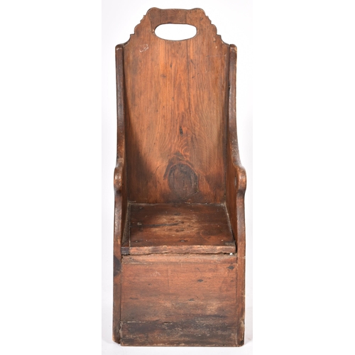 359 - An 18th Century oak and stained pine children's chair having a tall carved backrest with central han... 