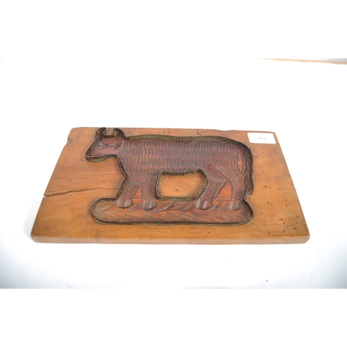 369 - A 19th Century treen gingerbread mould in the form of a cow. Rectangular form with central depiction... 