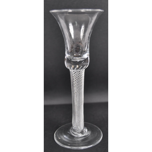 37 - An 18th Century George III wine drinking glass having a bell shaped bowl with air twist stem raised ... 