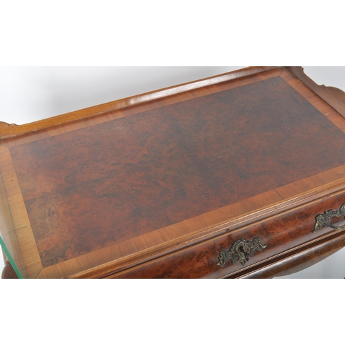 373 - A 19th Century walnut silver table having a raised gallery edge tray top with single drawer to the f... 