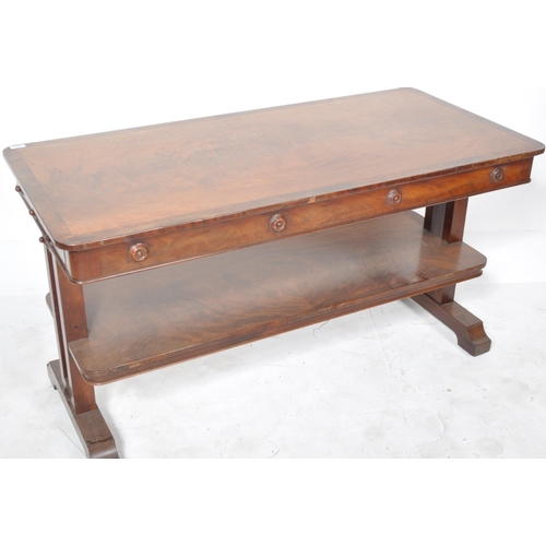 375 - A 19th Century William IV mahogany sofa table / writing table desk having a chamfered edge with carv... 