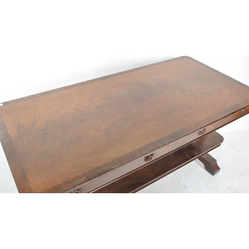 375 - A 19th Century William IV mahogany sofa table / writing table desk having a chamfered edge with carv... 