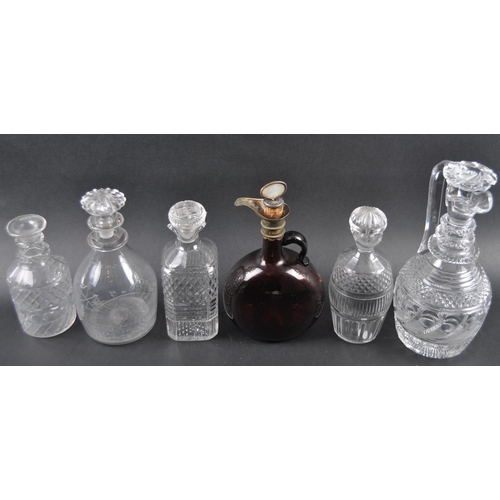 386 - A collection of 19th century glass decanters. Six hand blown and hand cut to include engraved glass ... 