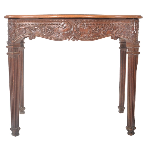 387 - An 18th Century Robert Adam carved oak hall table having a serpentine chamfered edge top over a deco... 