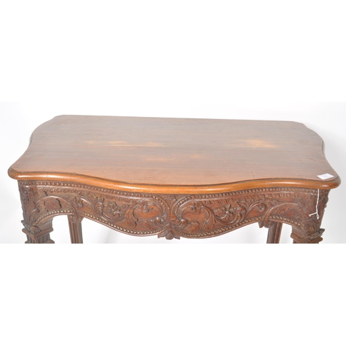 387 - An 18th Century Robert Adam carved oak hall table having a serpentine chamfered edge top over a deco... 