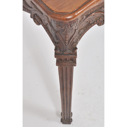 387 - An 18th Century Robert Adam carved oak hall table having a serpentine chamfered edge top over a deco... 