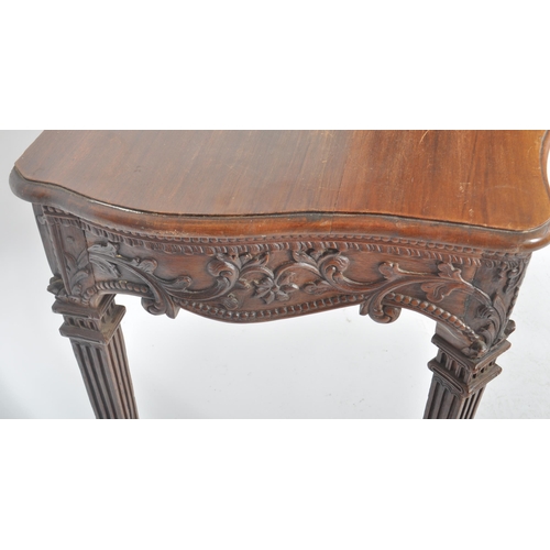 387 - An 18th Century Robert Adam carved oak hall table having a serpentine chamfered edge top over a deco... 