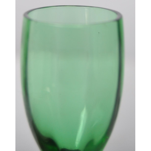 393 - A set of six early 20th Century green glass and silver based liquor drinking glasses. Gently faceted... 