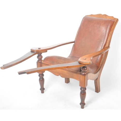 395 - A 19th Century Victorian Colonial mahogany and leather plantation chair, with swing out leg rests ra... 