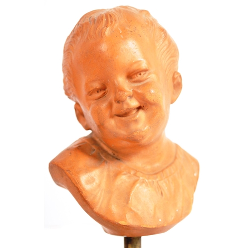 407 - A pair of 19th Century terracotta busts / portrait studies depicting infants / cherub puttis. Orange... 