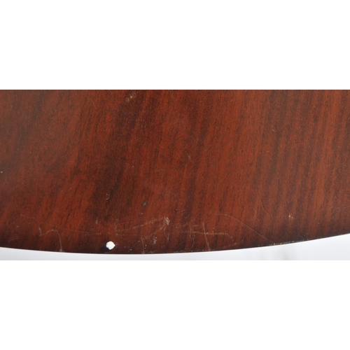 42 - An early 20th Century Edwardian mahogany centre table of circular form. Rosettes to the frieze with ... 